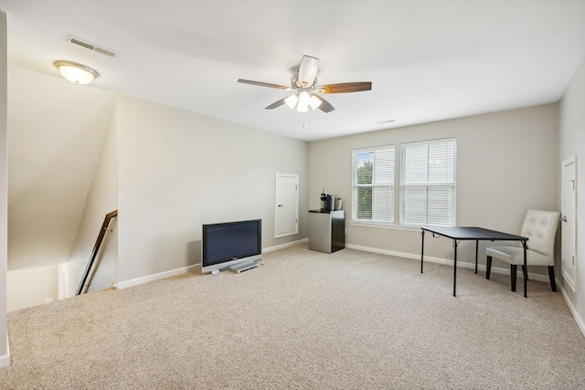 sitting room featuring ceiling fan and light colored carpet