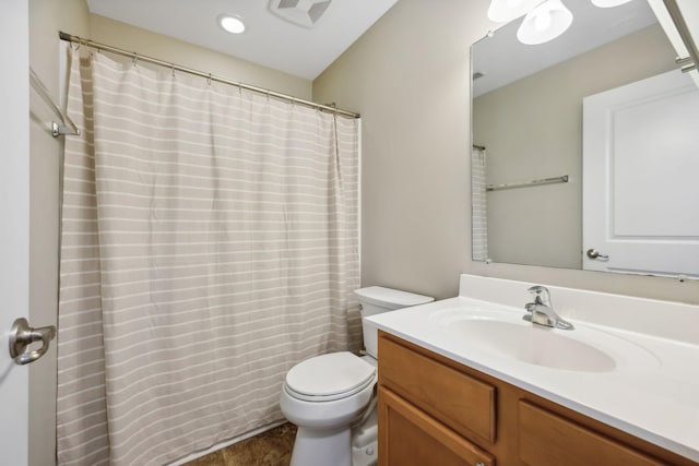 bathroom with tile patterned floors, vanity, and toilet