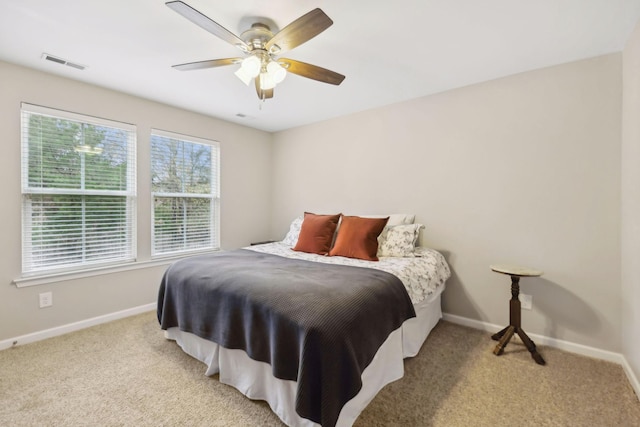 bedroom featuring ceiling fan and light colored carpet