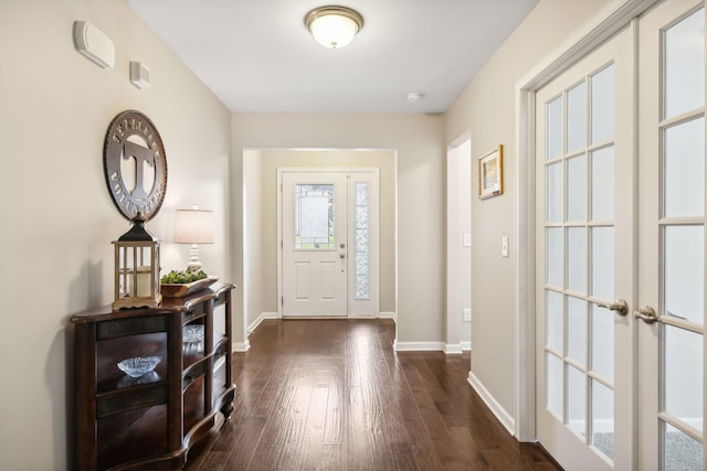 entrance foyer with french doors and dark hardwood / wood-style floors