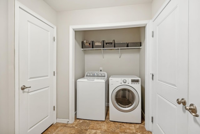 washroom with washer and clothes dryer