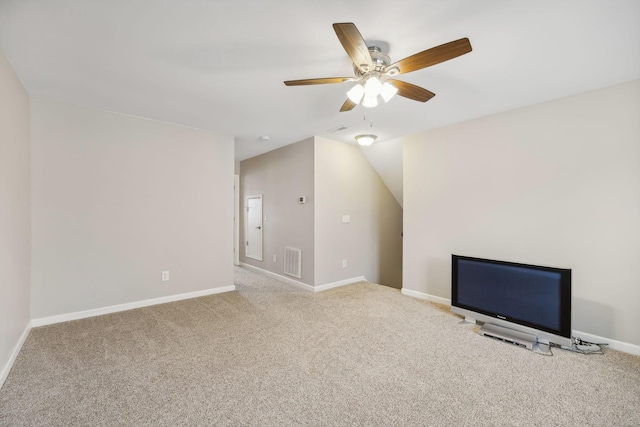 unfurnished living room with ceiling fan and carpet floors