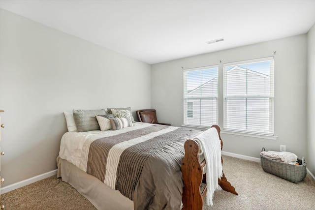 bedroom with light carpet