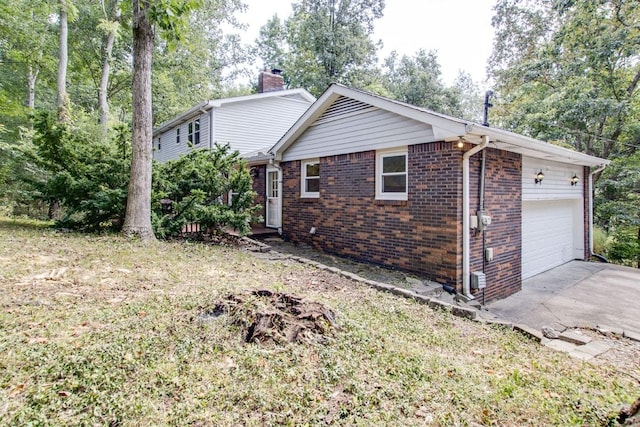 view of property exterior featuring a garage and a yard