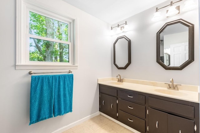 bathroom with tile patterned flooring and vanity