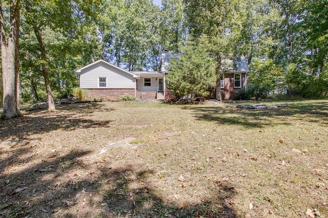 view of yard featuring covered porch