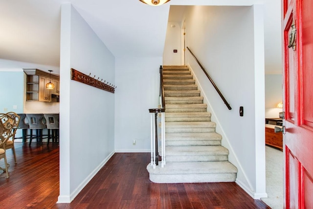 stairway with hardwood / wood-style flooring