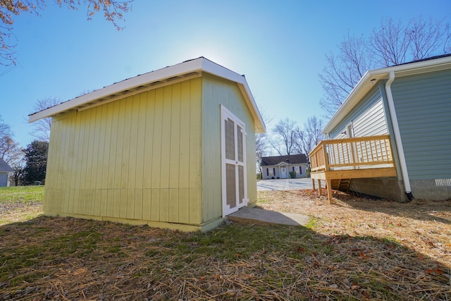 view of property exterior featuring a wooden deck