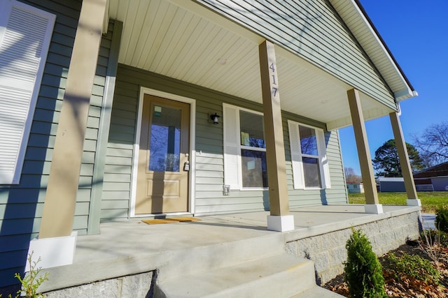 doorway to property featuring covered porch