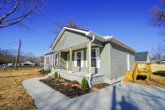 view of property exterior featuring covered porch