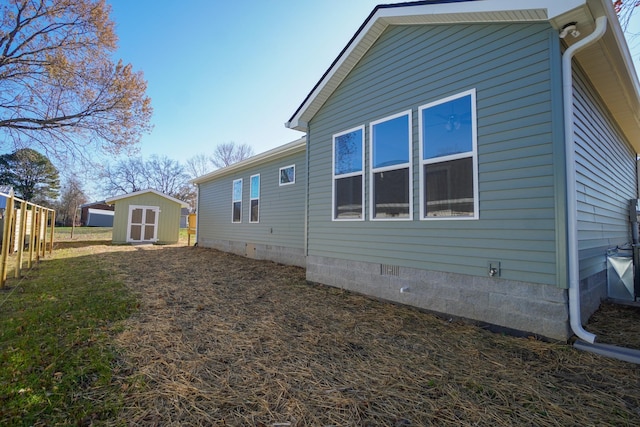 view of property exterior featuring a shed