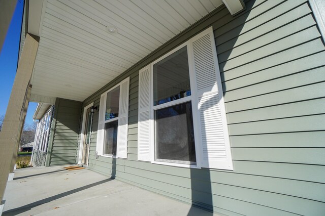 view of side of property featuring a porch