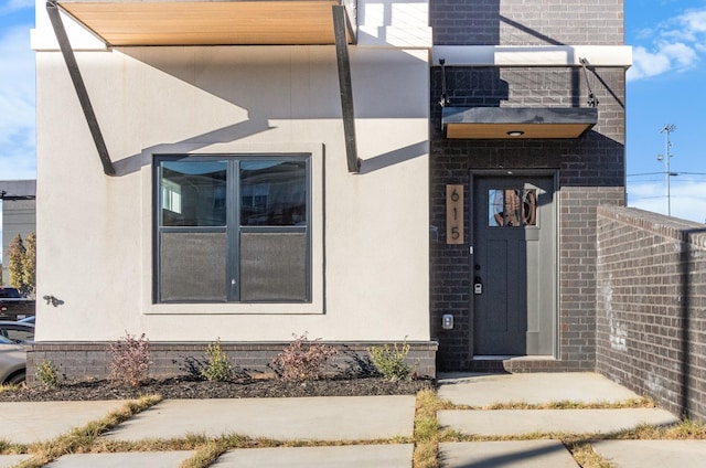 doorway to property featuring a balcony