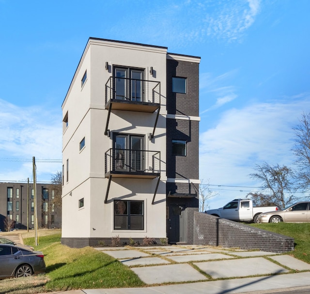 view of front of home with a balcony