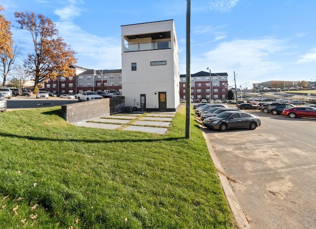 view of home's exterior featuring a lawn