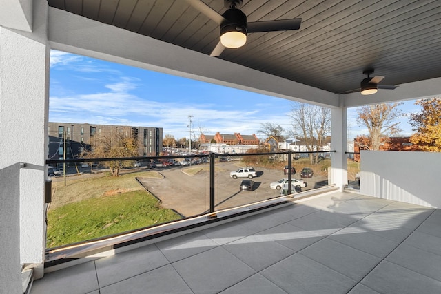 view of patio / terrace featuring ceiling fan and a balcony