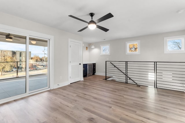 interior space with ceiling fan and light wood-type flooring