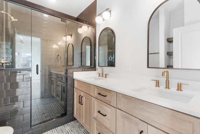 bathroom with tile patterned flooring, vanity, and walk in shower