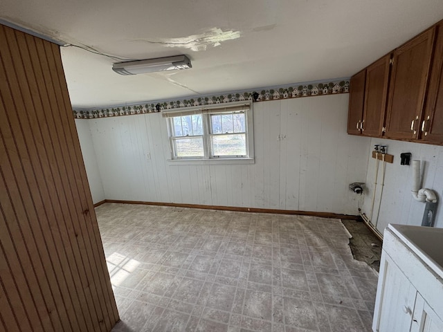1200 N Church St, Portland, TN 37148 - washroom with cabinet space and wooden walls