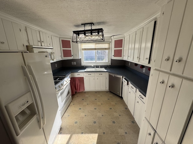 kitchen featuring white cabinetry, white appliances, a textured ceiling, and hanging light fixtures