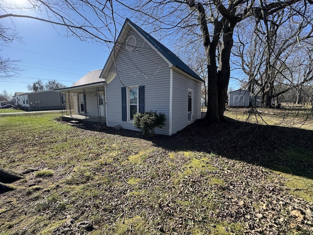 view of home's exterior with a yard