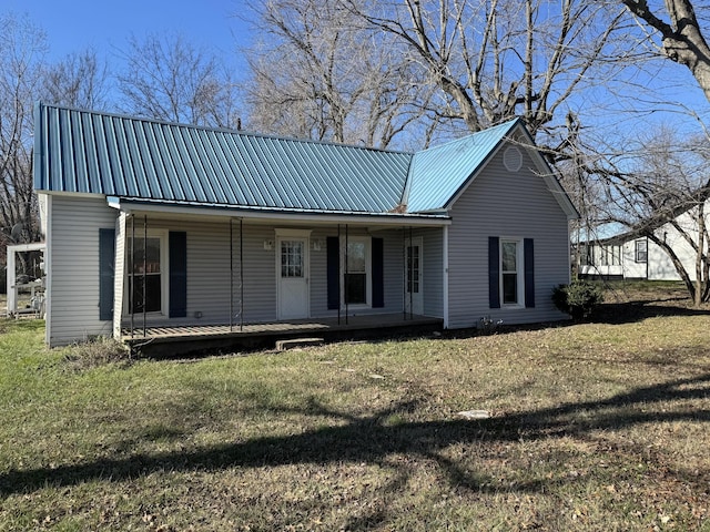1200 N Church St, Portland, TN 37148 - view of front facade featuring a metal roof, covered porch, and a front lawn