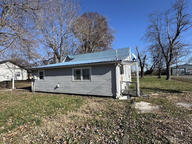 view of home's exterior featuring a lawn