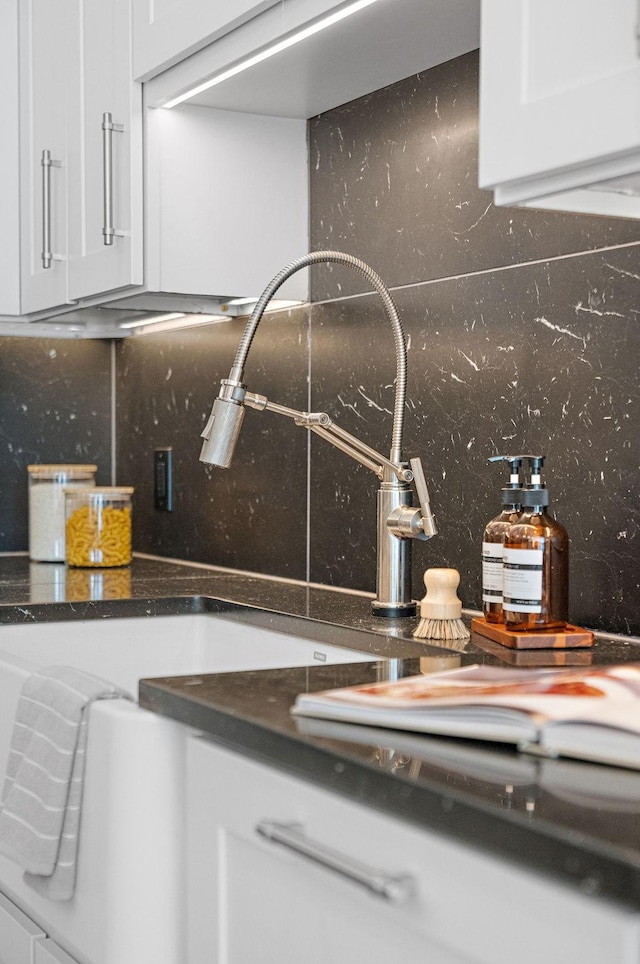 details with tasteful backsplash and white cabinetry