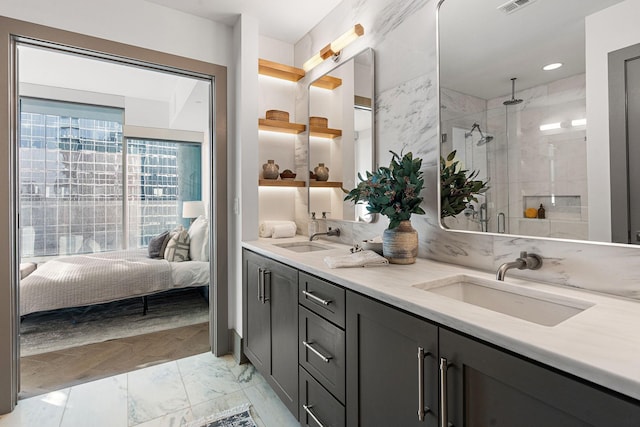 bathroom featuring vanity and a shower with shower door