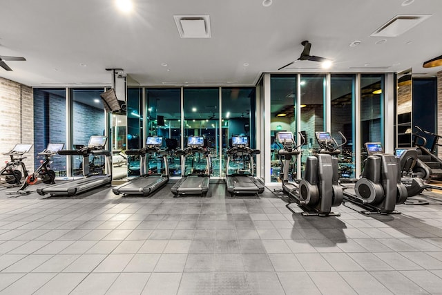 gym with floor to ceiling windows and plenty of natural light