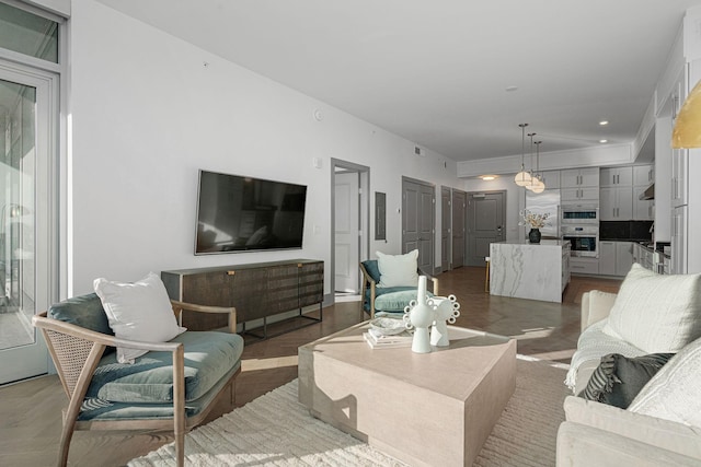 living room with wood-type flooring and electric panel