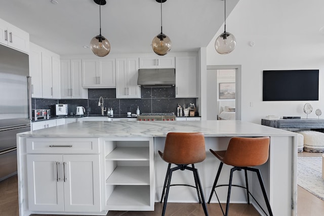 kitchen with pendant lighting and white cabinetry