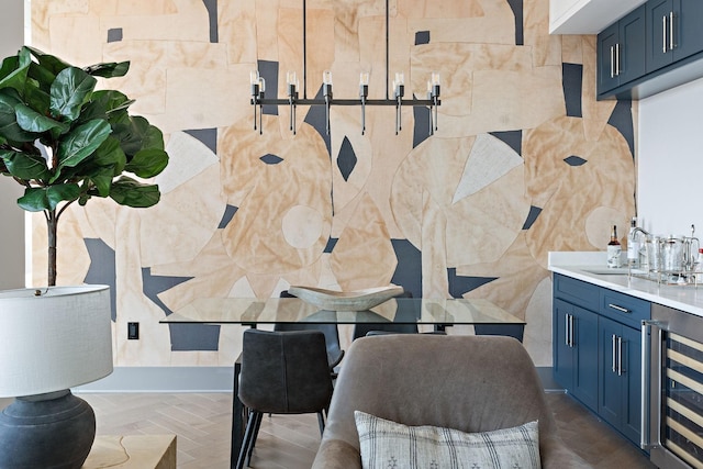 interior space featuring sink, beverage cooler, and parquet flooring