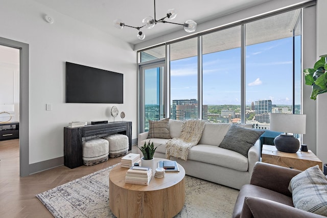 1616 W End Ave Unit 2011, Nashville, TN 37203 - living room featuring healthy amount of natural light and a chandelier