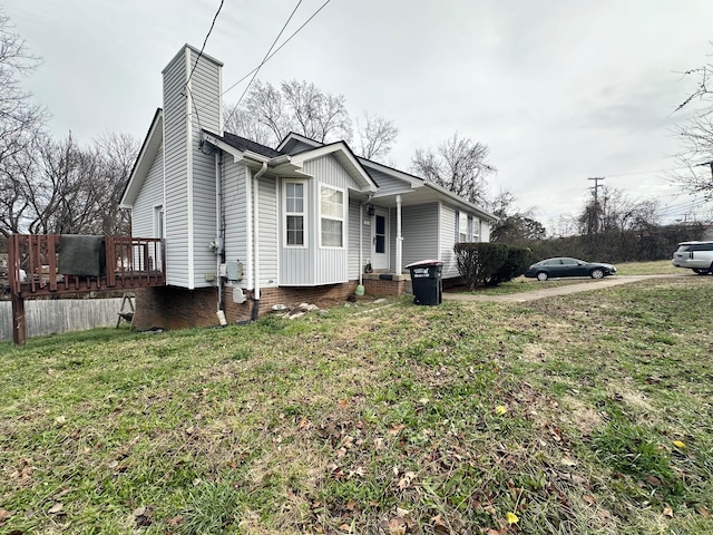 view of property exterior with a lawn