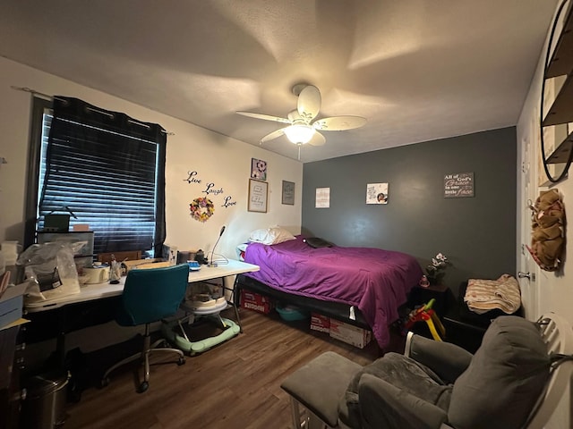 bedroom with wood-type flooring and ceiling fan