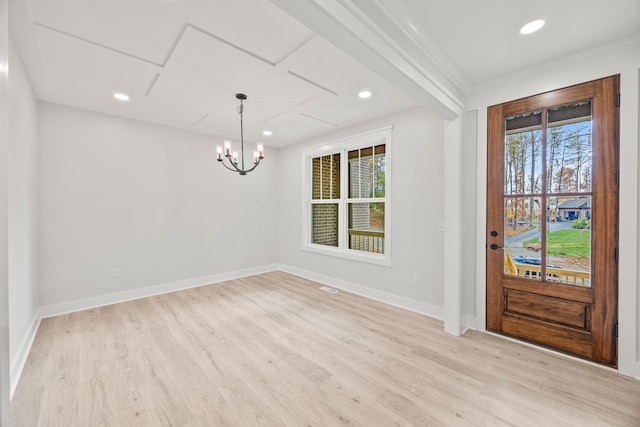 entryway with crown molding, light hardwood / wood-style flooring, and a healthy amount of sunlight