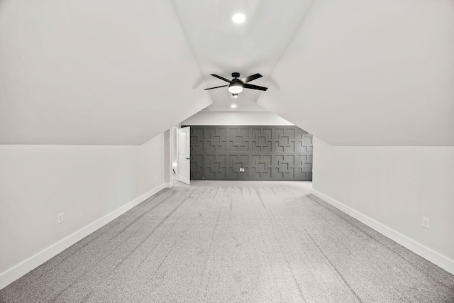 bonus room with ceiling fan, carpet, and lofted ceiling