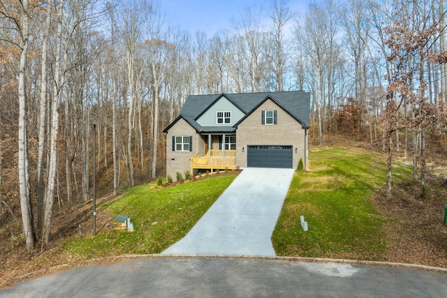 view of front of home with a garage and a front yard