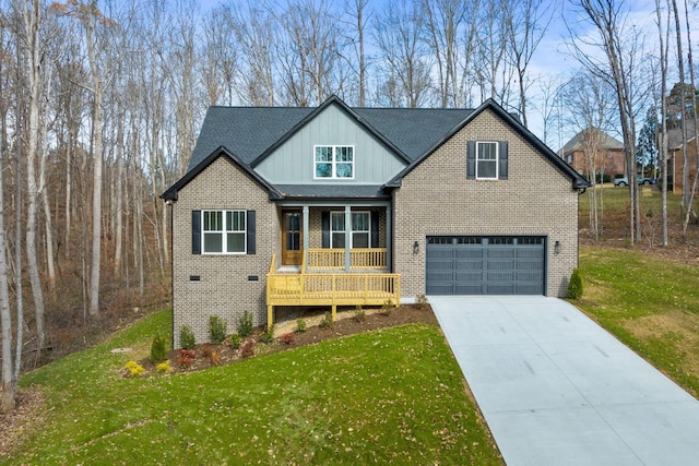 view of front facade featuring a porch, a garage, and a front yard