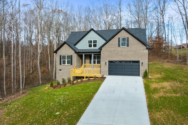 view of front facade with a porch, a garage, and a front yard