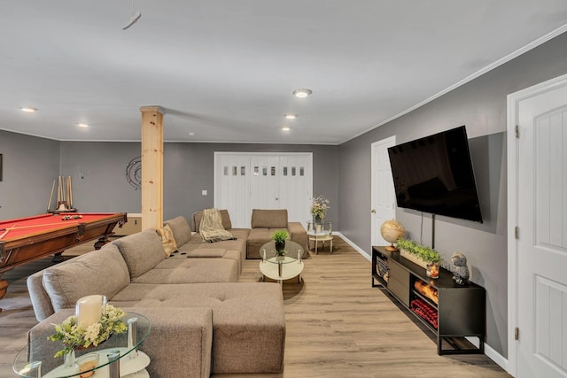 living room featuring ornamental molding, pool table, and light hardwood / wood-style flooring