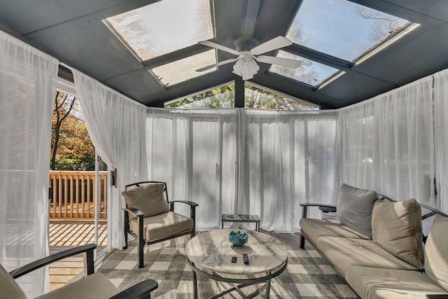 sunroom / solarium with ceiling fan and lofted ceiling with skylight