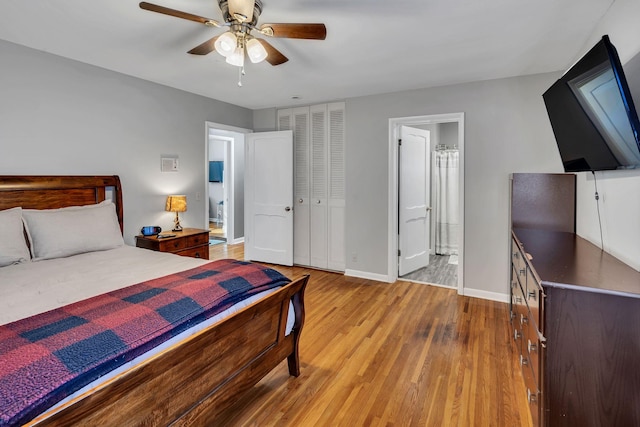 bedroom featuring a closet, ceiling fan, light hardwood / wood-style flooring, and ensuite bathroom