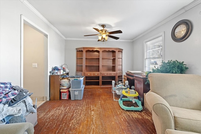 living room with crown molding, ceiling fan, and dark wood-type flooring