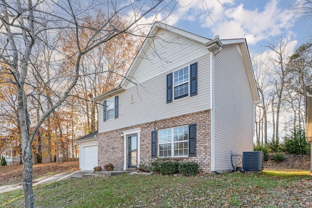 view of property featuring central AC and a front lawn