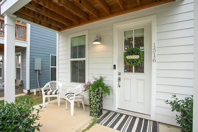 doorway to property featuring covered porch