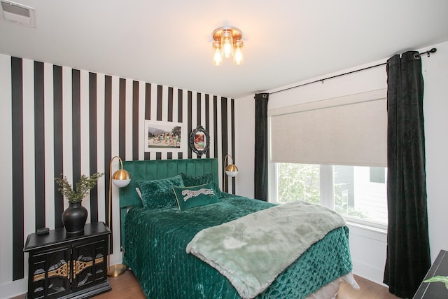 bedroom featuring hardwood / wood-style flooring