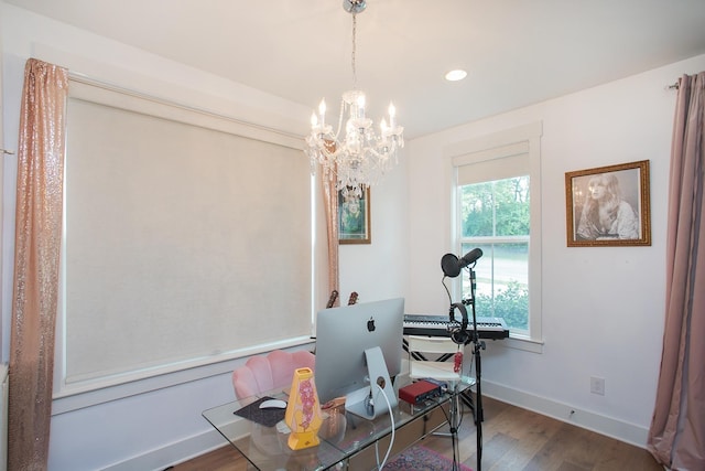 office area featuring dark hardwood / wood-style flooring and an inviting chandelier