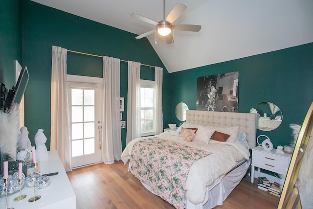 bedroom featuring wood-type flooring, vaulted ceiling, and ceiling fan